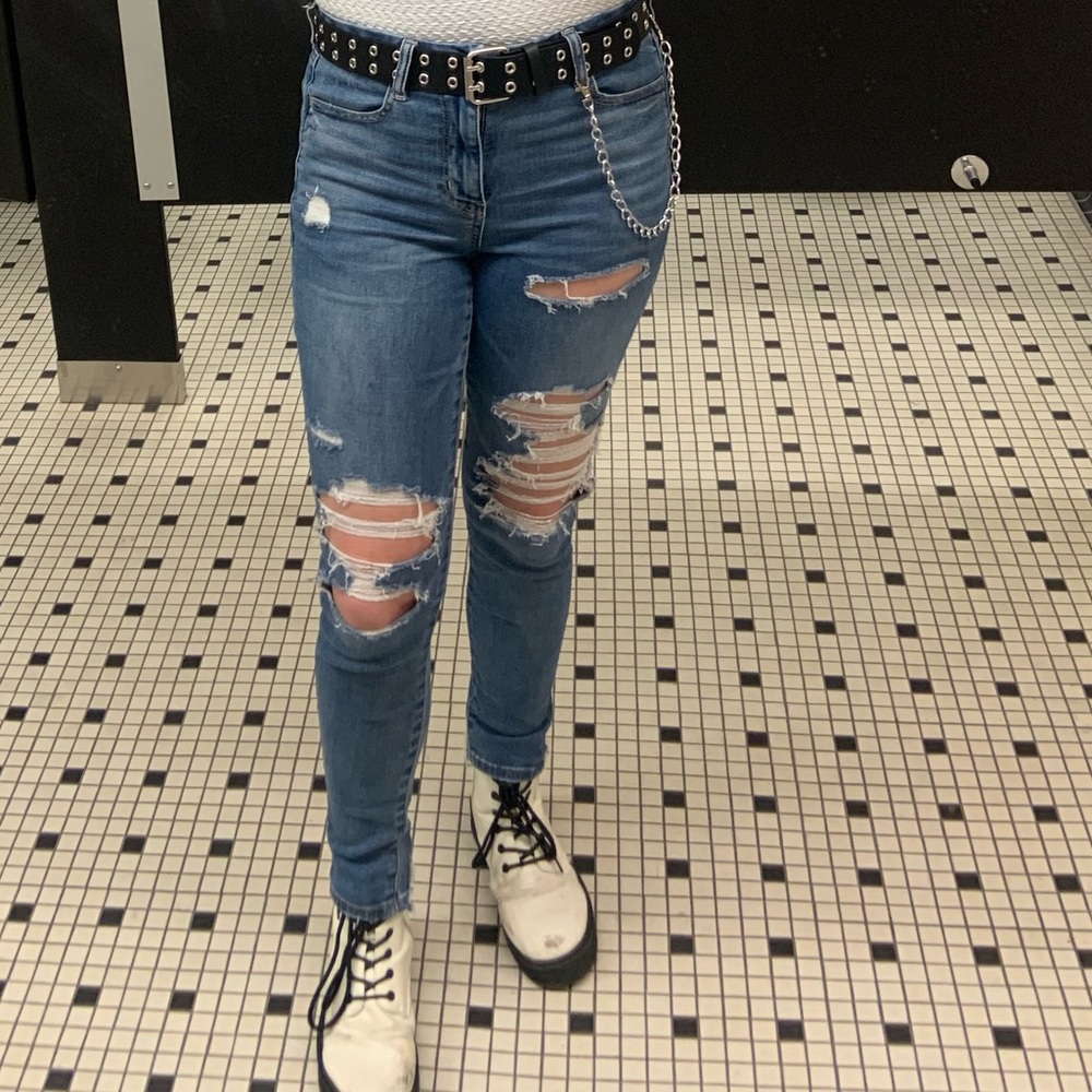 Pair of dark wash ripped jeans